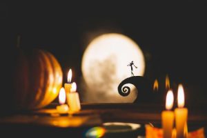 Silhouette of Jack Skellington with candles in the foreground