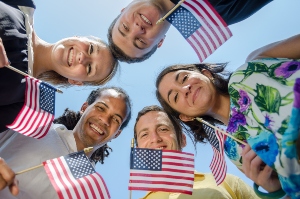 Diverse young Americans holding mini American flags for Memorial Day