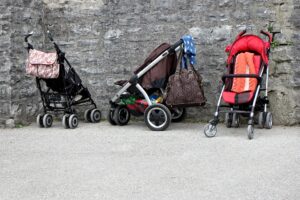 Orlando with a toddler - strollers lined up along a stone wall