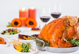 Rosen Shingle Creek's Thanksgiving Day buffet display with turkey, wine, and assorted vegetables.