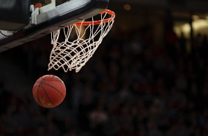 A basketball being shot into a hoop. The Orlando Magic will be facing the Knicks at the Amway Center on Valentine's day.